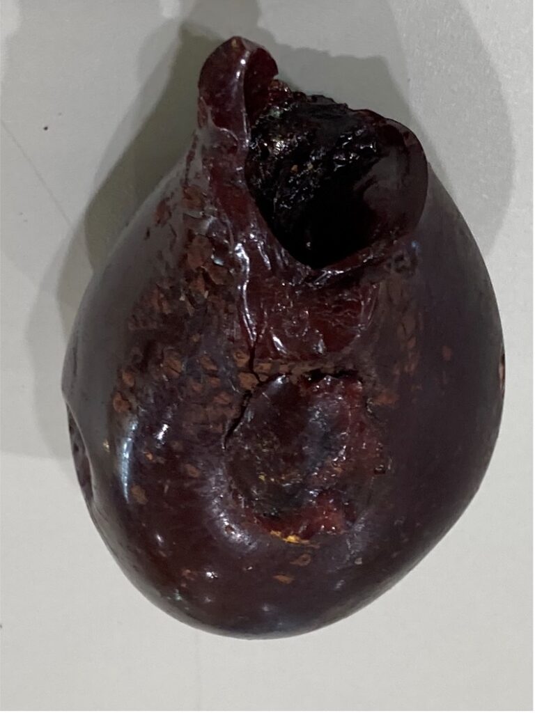 A large, 10cm tear-shaped piece of ruby-red resin from a grass tree