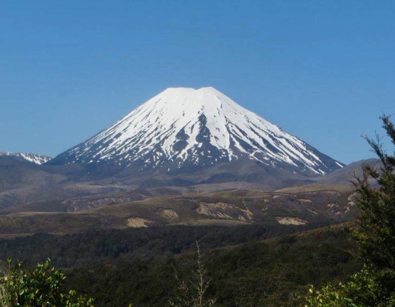 A mountain with snow on top Description automatically generated